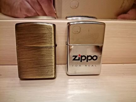 Две настоящие зажигалки Zippo
