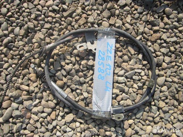 Трос ручника левый Toyota Corolla Spacio ZZE122