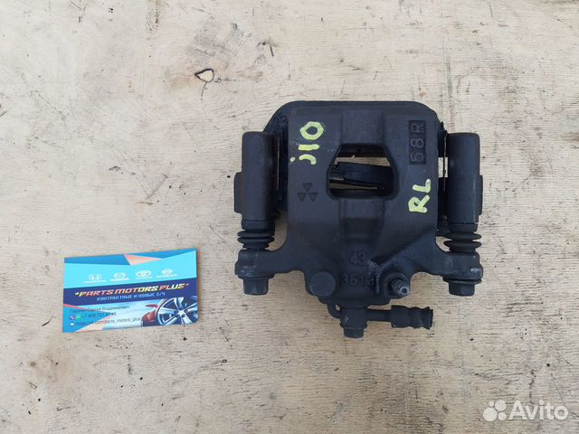 Суппорт тормозной задний левый Nissan Qashqai J10