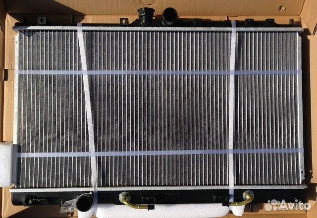 Новый радиатор охлаждения Mitsubishi Lancer 9